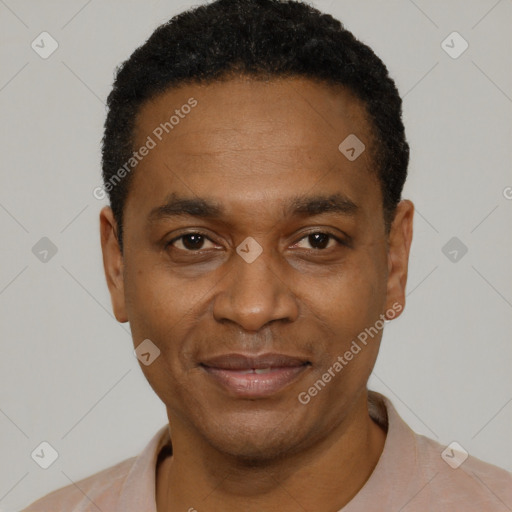 Joyful black adult male with short  black hair and brown eyes