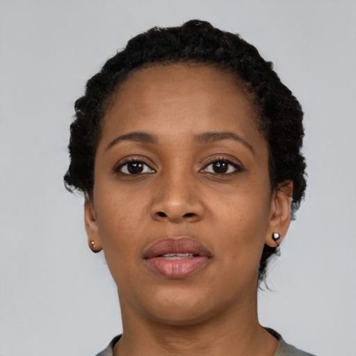 Neutral black young-adult female with short  black hair and brown eyes