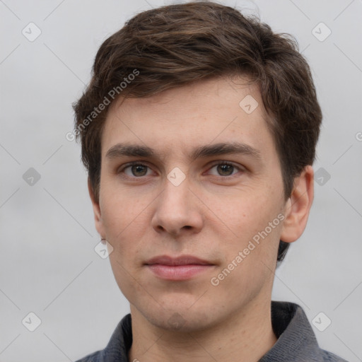 Neutral white young-adult male with short  brown hair and grey eyes