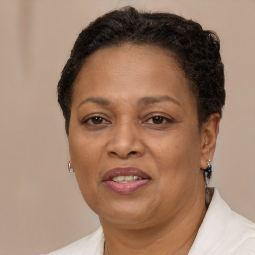 Joyful latino adult female with short  brown hair and brown eyes