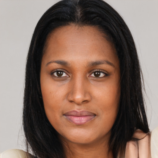 Joyful asian young-adult female with long  brown hair and brown eyes