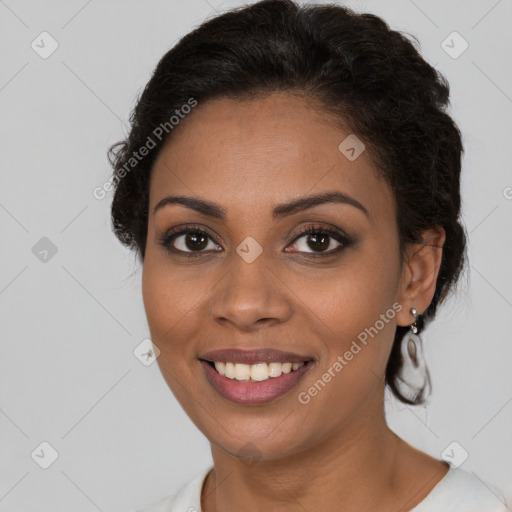 Joyful black young-adult female with medium  brown hair and brown eyes