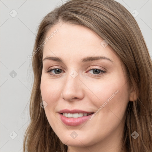 Joyful white young-adult female with long  brown hair and grey eyes