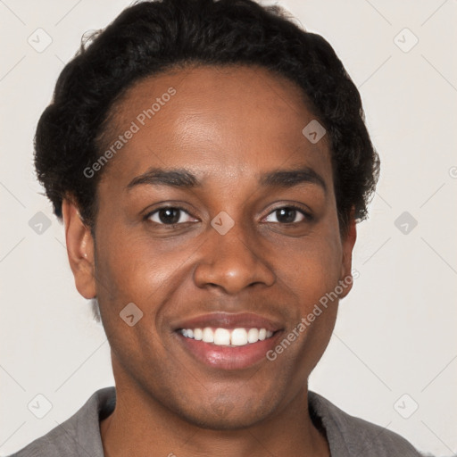 Joyful black young-adult male with short  brown hair and brown eyes