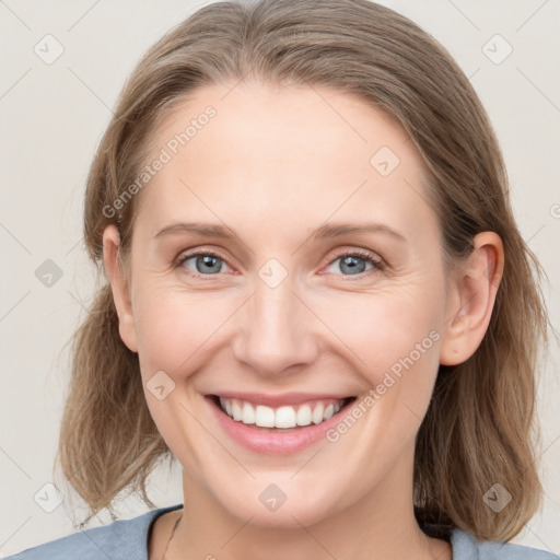 Joyful white young-adult female with medium  brown hair and blue eyes