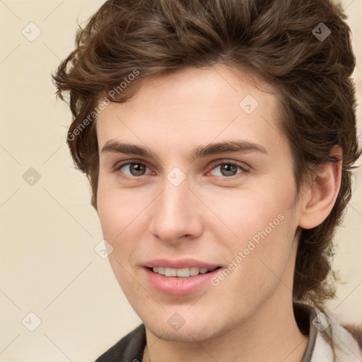 Joyful white young-adult male with medium  brown hair and brown eyes