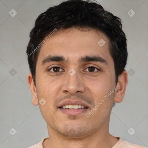 Joyful white young-adult male with short  black hair and brown eyes