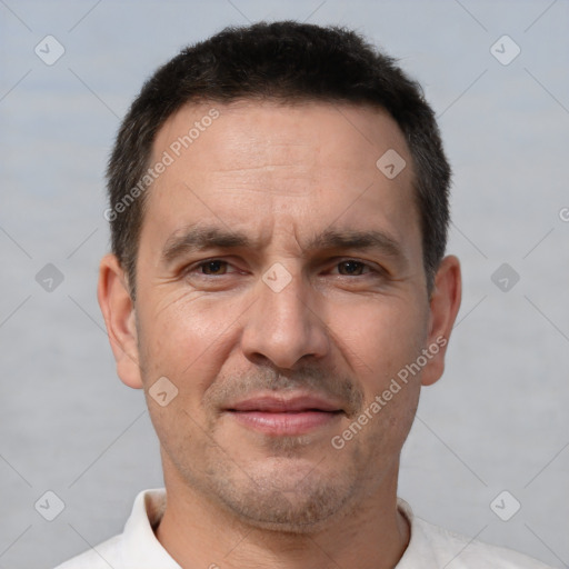 Joyful white adult male with short  brown hair and brown eyes