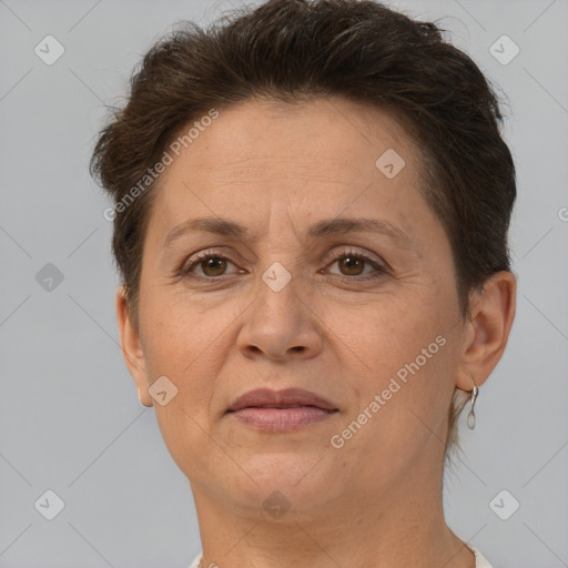 Joyful white adult female with short  brown hair and brown eyes