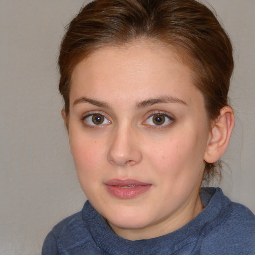 Joyful white young-adult female with medium  brown hair and blue eyes