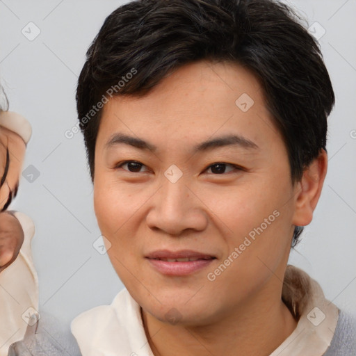 Joyful asian young-adult female with short  brown hair and brown eyes