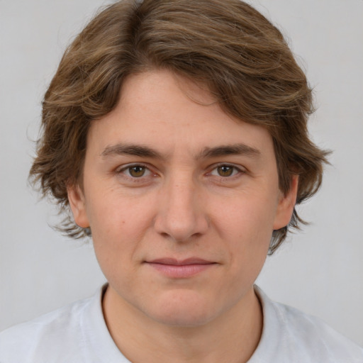 Joyful white young-adult male with medium  brown hair and brown eyes