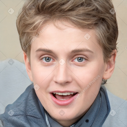 Joyful white young-adult female with short  brown hair and blue eyes