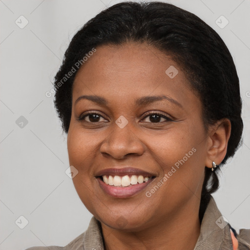 Joyful black young-adult female with medium  brown hair and brown eyes