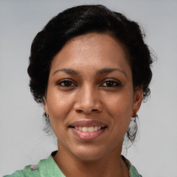 Joyful asian young-adult female with medium  black hair and brown eyes