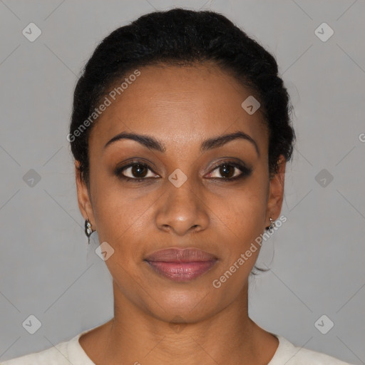 Joyful black young-adult female with short  black hair and brown eyes