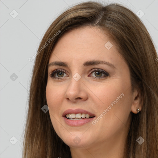 Joyful white young-adult female with long  brown hair and brown eyes