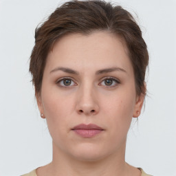 Neutral white young-adult female with short  brown hair and brown eyes