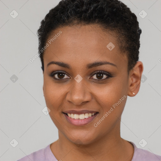 Joyful black young-adult female with short  brown hair and brown eyes