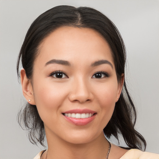 Joyful white young-adult female with medium  brown hair and brown eyes