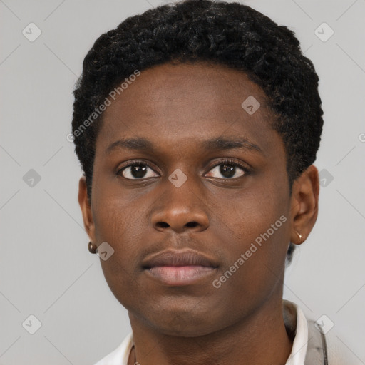 Neutral black young-adult male with short  brown hair and brown eyes