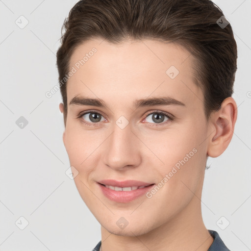 Joyful white young-adult female with short  brown hair and brown eyes