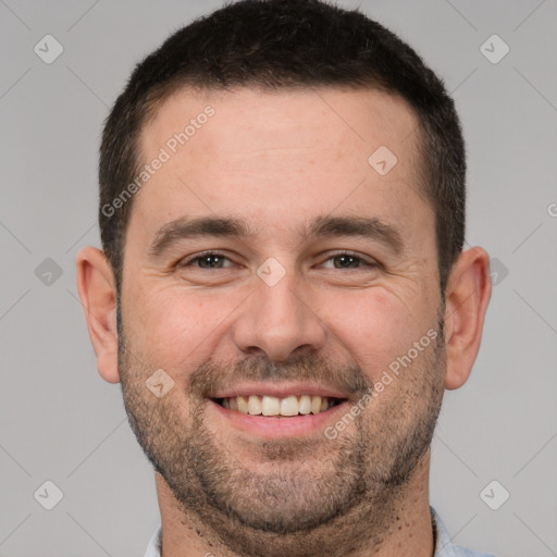 Joyful white adult male with short  brown hair and brown eyes