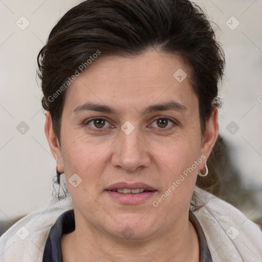 Joyful white adult female with short  brown hair and brown eyes