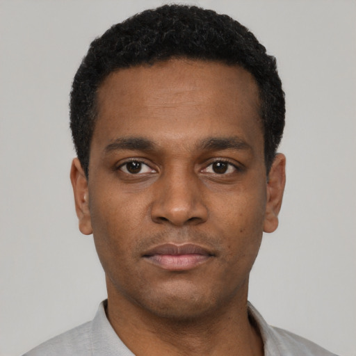 Neutral black young-adult male with short  black hair and brown eyes