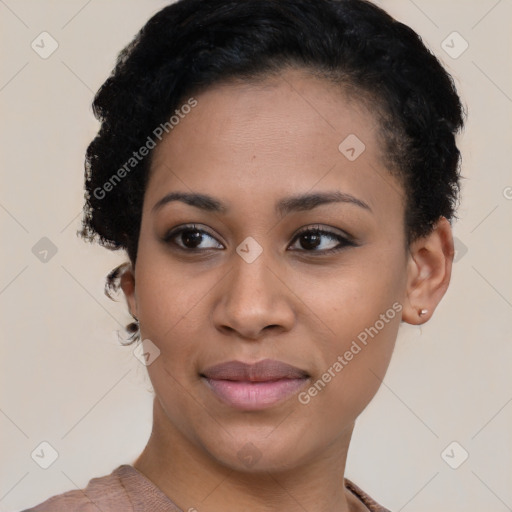 Joyful black young-adult female with short  black hair and brown eyes