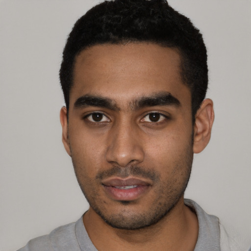 Neutral black young-adult male with short  black hair and brown eyes
