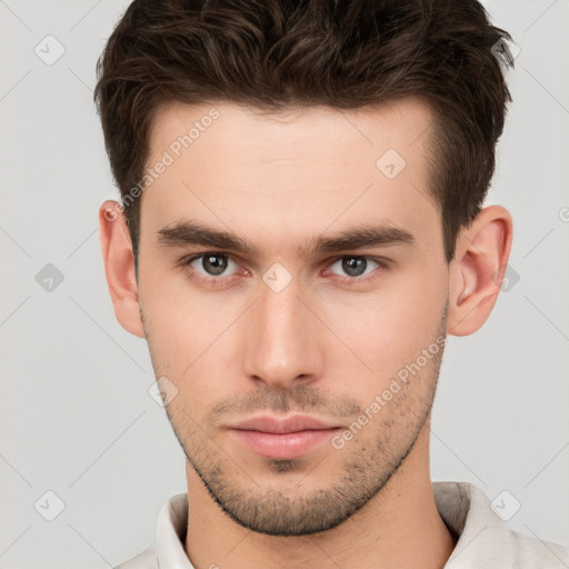 Neutral white young-adult male with short  brown hair and brown eyes