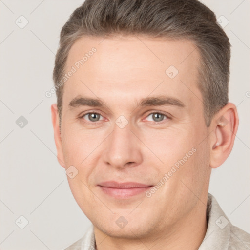 Joyful white adult male with short  brown hair and brown eyes