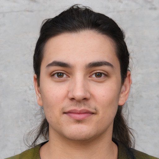 Joyful white young-adult male with short  brown hair and brown eyes