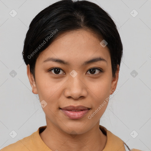 Joyful latino young-adult female with short  brown hair and brown eyes