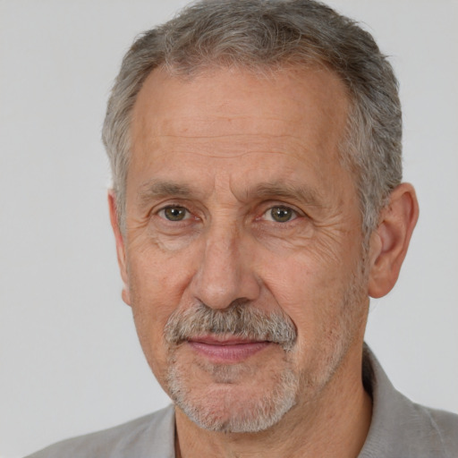 Neutral white middle-aged male with short  gray hair and brown eyes