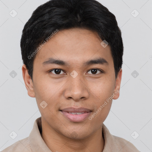 Joyful asian young-adult male with short  brown hair and brown eyes