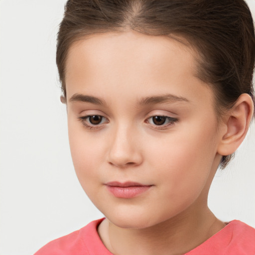 Joyful white child female with short  brown hair and brown eyes