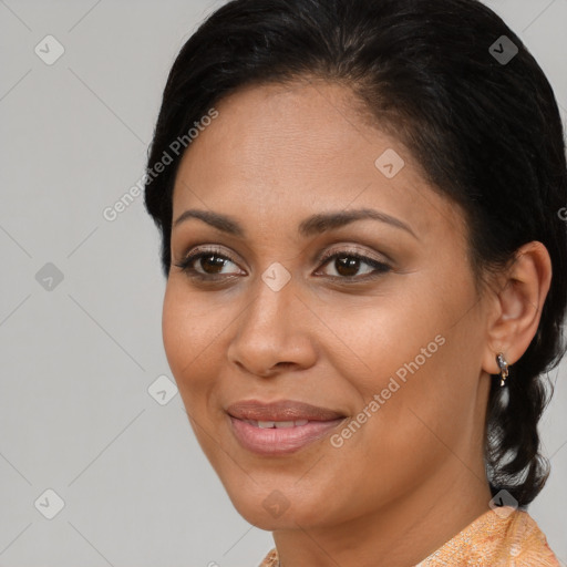 Joyful latino young-adult female with medium  brown hair and brown eyes