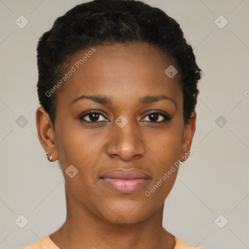 Joyful black young-adult female with short  brown hair and brown eyes