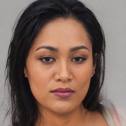 Joyful asian young-adult female with long  brown hair and brown eyes
