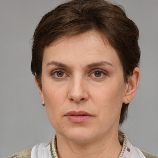 Neutral white adult female with short  brown hair and grey eyes