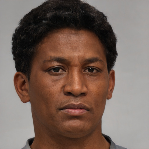 Neutral black young-adult male with short  brown hair and brown eyes