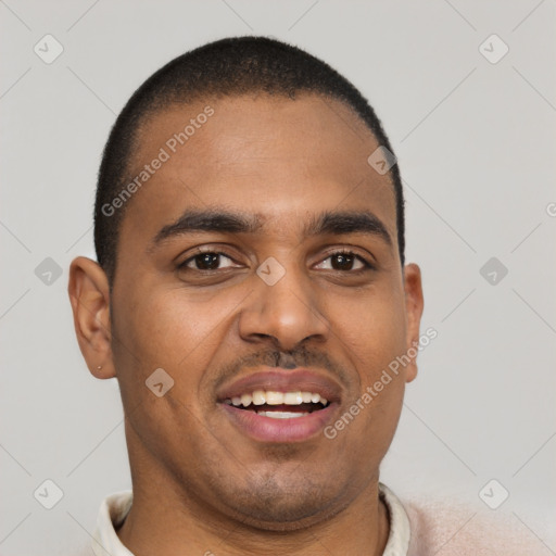 Joyful black young-adult male with short  black hair and brown eyes