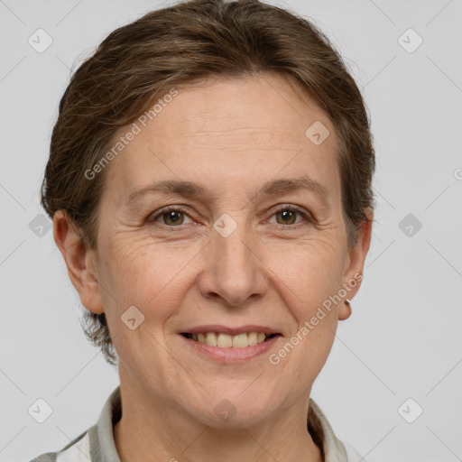 Joyful white adult female with short  brown hair and grey eyes