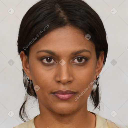 Joyful black young-adult female with medium  brown hair and brown eyes