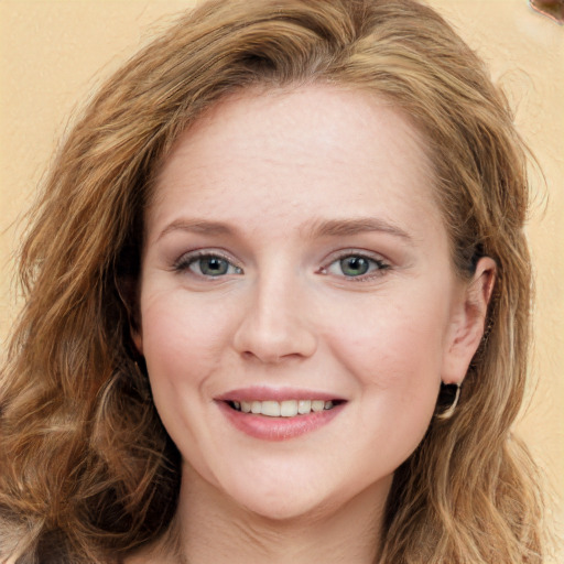 Joyful white young-adult female with long  brown hair and green eyes