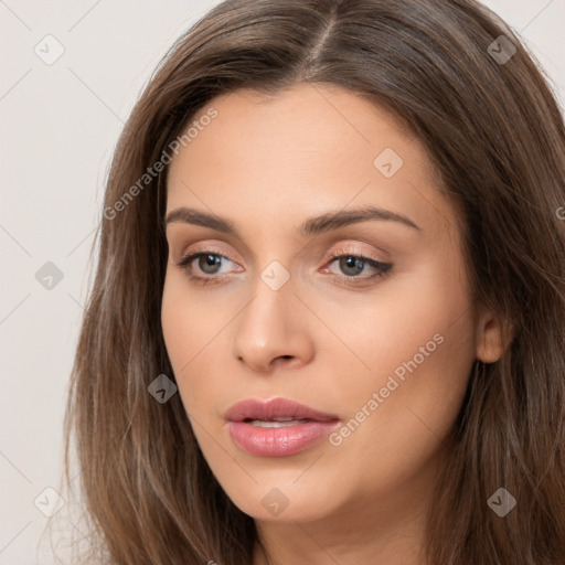 Neutral white young-adult female with long  brown hair and brown eyes