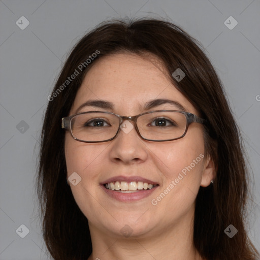 Joyful white adult female with medium  brown hair and brown eyes