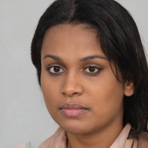 Neutral black young-adult female with long  black hair and brown eyes